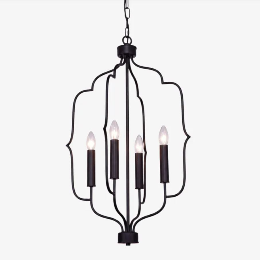 A five-light hanging chandelier with a black metal frame and decorative scrollwork, shown against a plain light gray background.