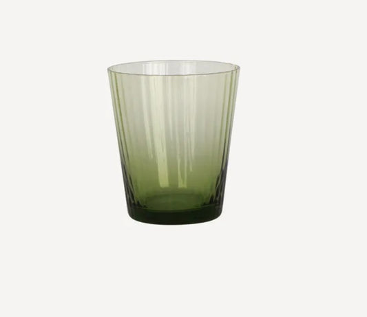 A green ribbed glass tumbler with a transparent rim.