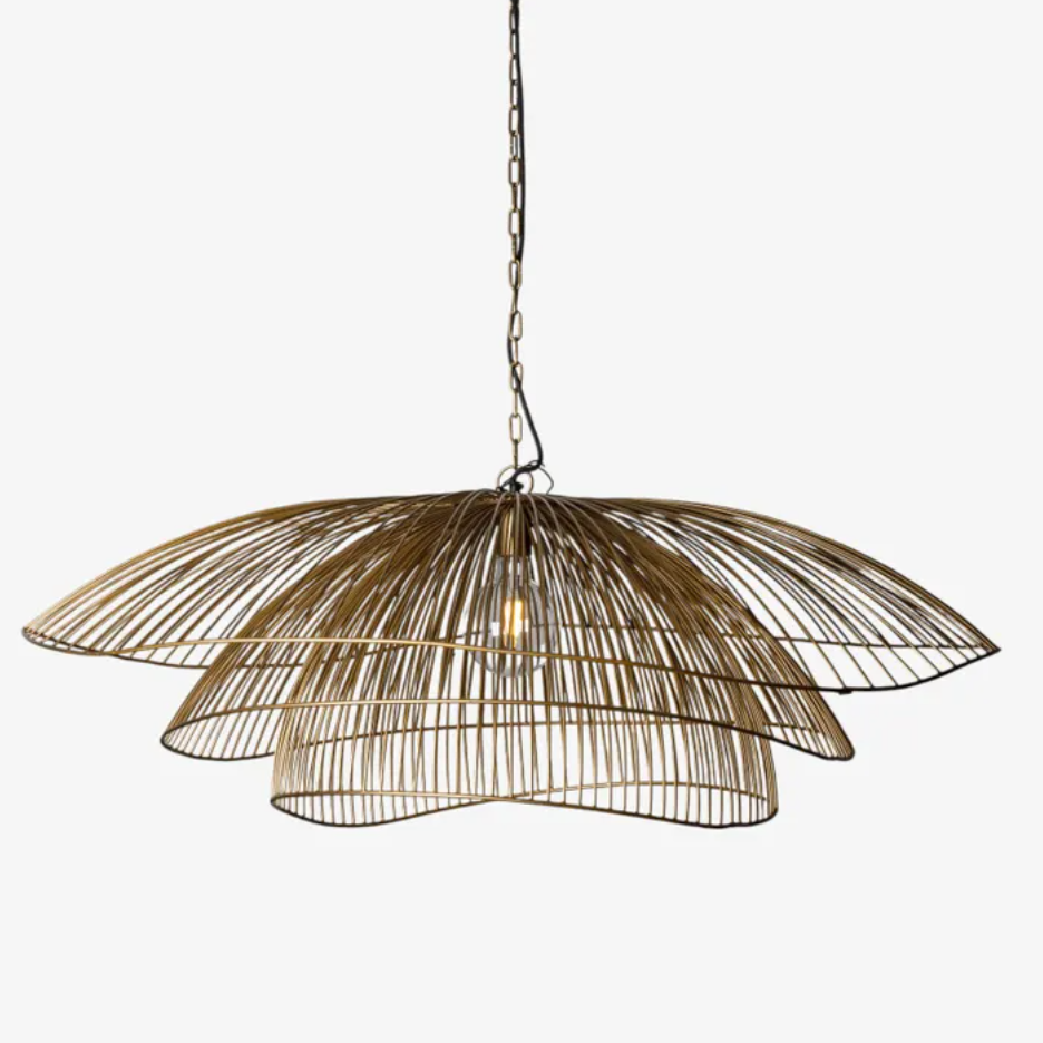 The Havana Layered Metal Pendant is a striking statement piece, defined by its sculptural form and beautifully layered silhouette. Its open, curved design creates a sense of movement and fluidity, while the structured iron framework brings an architectural element and understated strength. Finished in a warm antique brass, the pendant exudes a timeless sophistication that complements both traditional and contemporary interiors. Distinctive yet effortlessly elegant, the Havana is designed to make a considere
