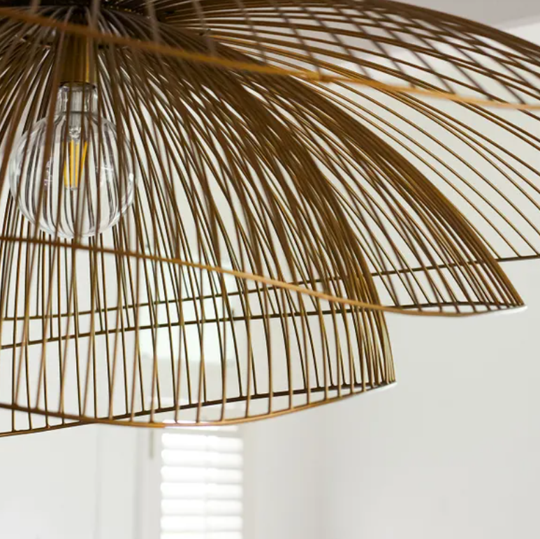 The Havana Layered Metal Pendant is a striking statement piece, defined by its sculptural form and beautifully layered silhouette. Its open, curved design creates a sense of movement and fluidity, while the structured iron framework brings an architectural element and understated strength. Finished in a warm antique brass, the pendant exudes a timeless sophistication that complements both traditional and contemporary interiors. Distinctive yet effortlessly elegant, the Havana is designed to make a considere