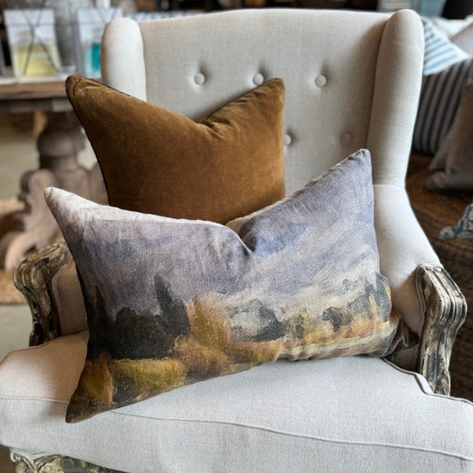 Experience the stunning beauty of nature with the Lake Hayes Lumbar Linen Cushion. Hand painted by a local Auckland artist, the tranquil warm colours and gentle shades embody the spirit of New Zealand's countryside. Ideal for any seat, this cushion is crafted from premium 100% organic French linen and comes with a plush feather insert for ultimate relaxation.

Dimensions: 40cm x 60cm