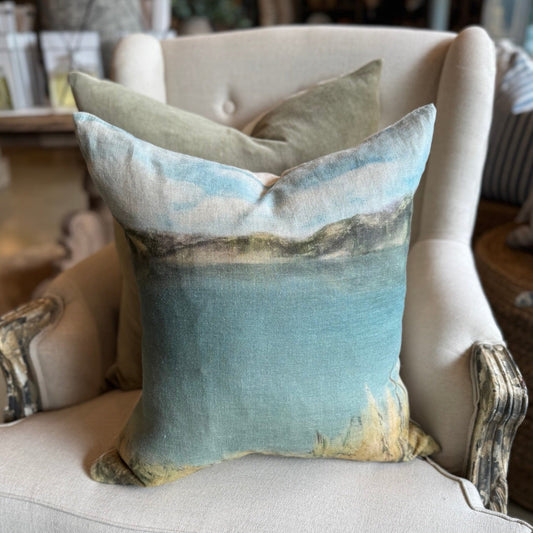 Experience the paradise of New Zealand with the Island Summer Linen Cushion. Meticulously hand-painted by a local artist, this cushion beautifully captures the tranquil blue hues and soft tones of the country's rural landscapes. Made with 100% French linen, it comes with a feather insert for maximum coziness and a plain reverse side for natural simplicity.