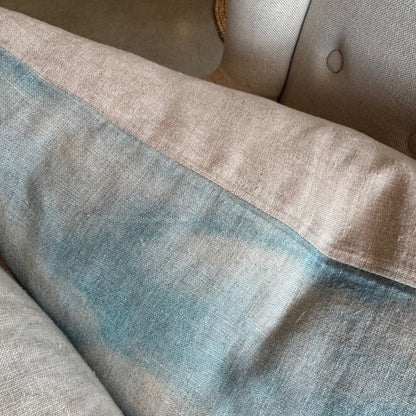 Indulge in the breath taking beauty of a tranquil beach landscape with the Island Summer Linen Cushion. Handcrafted by a local Auckland artist, the serene blues and soft hues capture the essence of New Zealand's rural settings. Perfect for any chair, this cushion is made from luxurious French organic linen and includes a feather filled insert for added comfort.