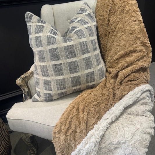 Transform any bedding or sofa into a cozy oasis with the Caramel &amp; Ivory Soft Throw. Its opulent texture adds charm to any space, effortlessly complementing other fabrics. The neutral hue, easy to match with varying tones, creates an inviting ambiance that will make you feel right at home. Plus, it's machine washable on a cold cycle for your convenience.