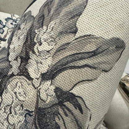 Revitalize your interior with the Warwick Grey Floral Linen &amp; Cotton Cushion, crafted from premium fabric by the distinguished Warwick Fabrics. The exquisite floral pattern in sophisticated grey and taupe tones creates a striking contrast against its neutral base, commanding attention in any room. This sumptuous cushion effortlessly enhances sofas, chairs, or bedding while delivering exceptional comfort with its lavish feather filling. An irresistible statement piece that elevates your home's ambiance