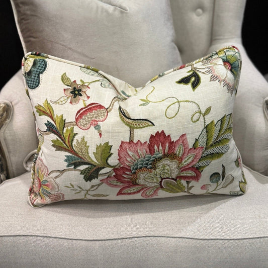 Transform your home decor this season with the elegant Colette Pink &amp; Green Floral Lumbar Cushion. Revel in the stunning pink and green flowers against a neutral backdrop, making it an ideal statement piece for any space. With a plush insert filled with feathers, you can enjoy both luxury and flair. The other side highlights a neutral tone, adding versatility.