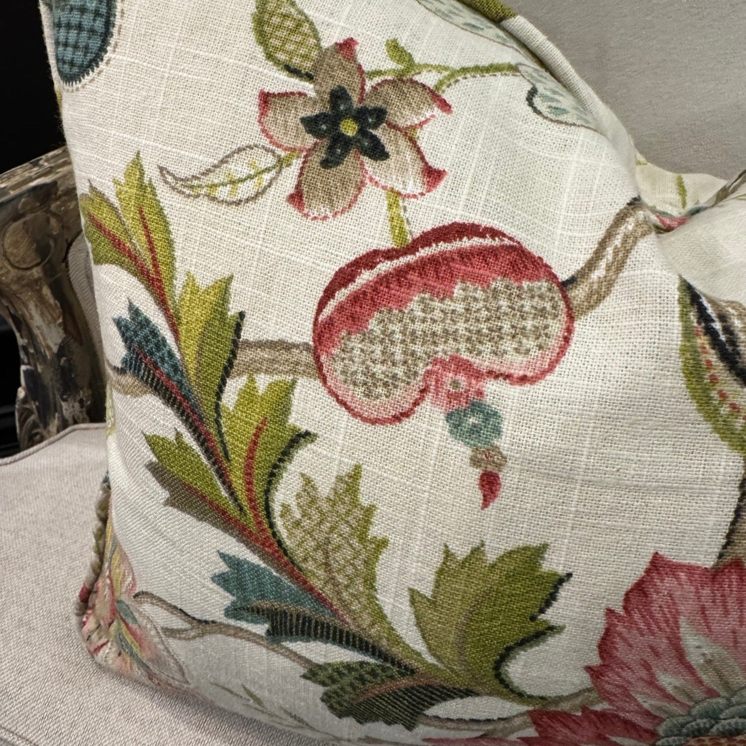 Transform your home decor this season with the elegant Colette Pink &amp; Green Floral Lumbar Cushion. Revel in the stunning pink and green flowers against a neutral backdrop, making it an ideal statement piece for any space. With a plush insert filled with feathers, you can enjoy both luxury and flair. The other side highlights a neutral tone, adding versatility.
