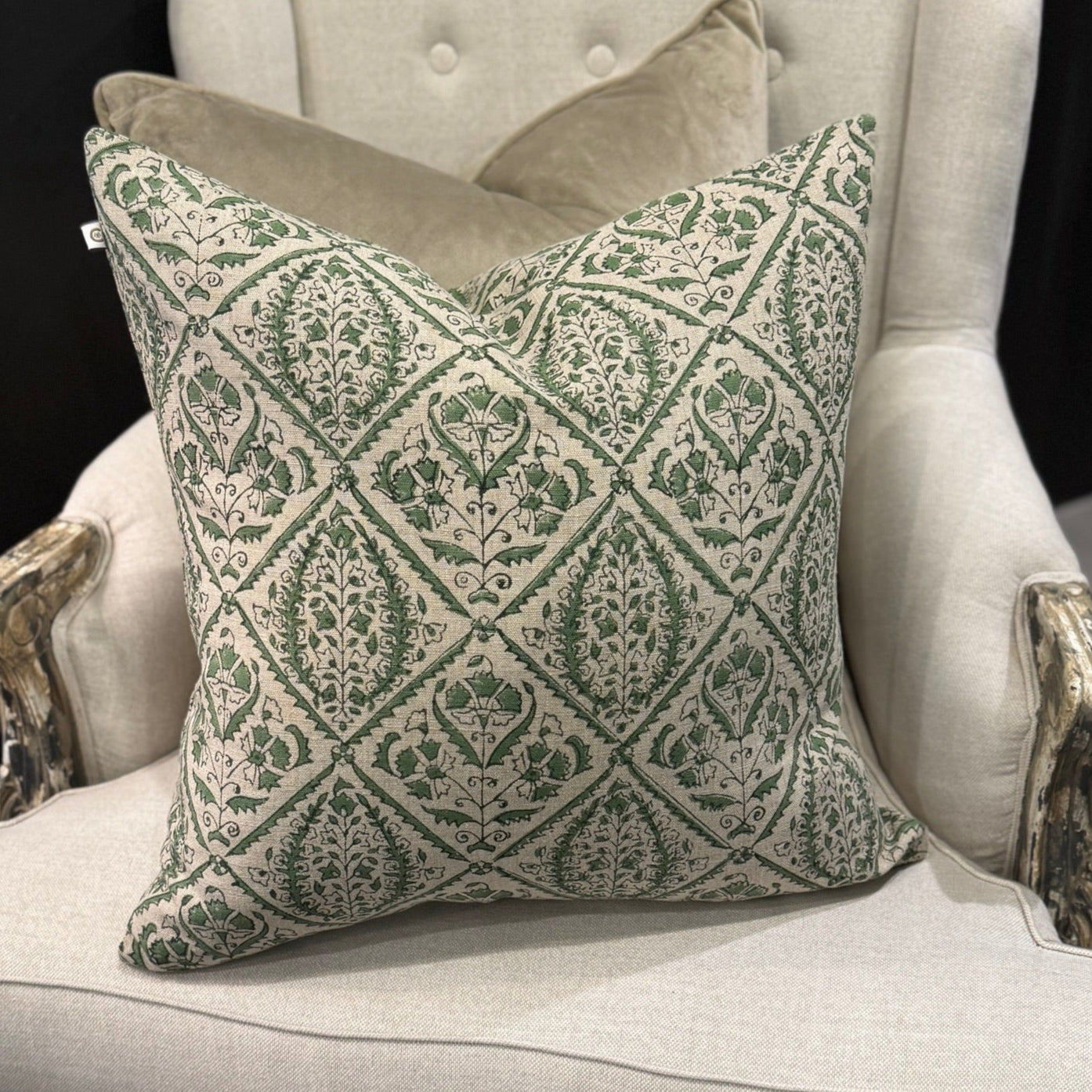 Indulge in the exquisite Jaipur Green Block Print Linen Cushion by Swedish Designer CHAMOIS. This luxurious accent showcases an intricate Indian block print pattern on sumptuous 100% Belgian linen, creating an unparalleled statement piece for your home. The premium feather insert provides exceptional comfort while the durable fabric ensures lasting beauty. Transform your interior with this sophisticated 50cm x 50cm cushion that perfectly balances artisanal craftsmanship with contemporary elegance.