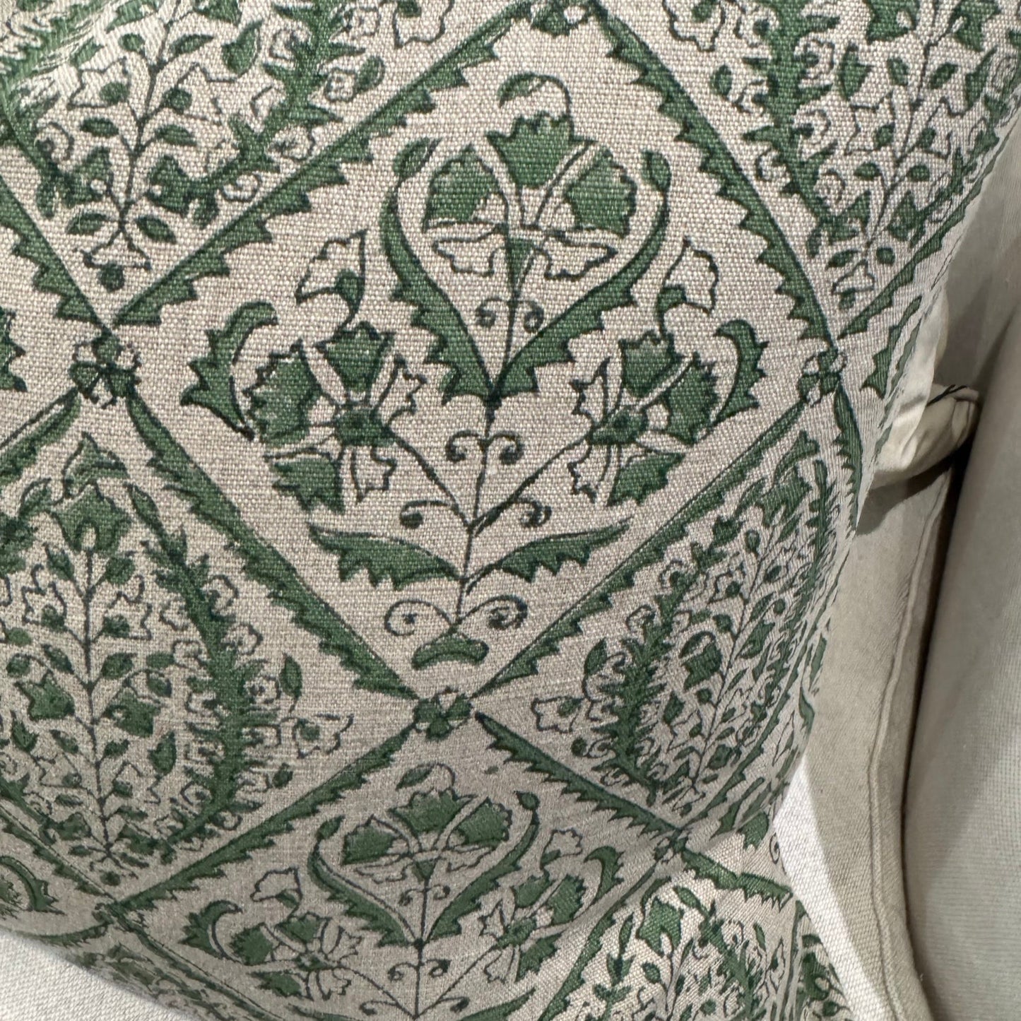 Indulge in the exquisite Jaipur Green Block Print Linen Cushion by Swedish Designer CHAMOIS. This luxurious accent showcases an intricate Indian block print pattern on sumptuous 100% Belgian linen, creating an unparalleled statement piece for your home. The premium feather insert provides exceptional comfort while the durable fabric ensures lasting beauty. Transform your interior with this sophisticated 50cm x 50cm cushion that perfectly balances artisanal craftsmanship with contemporary elegance.