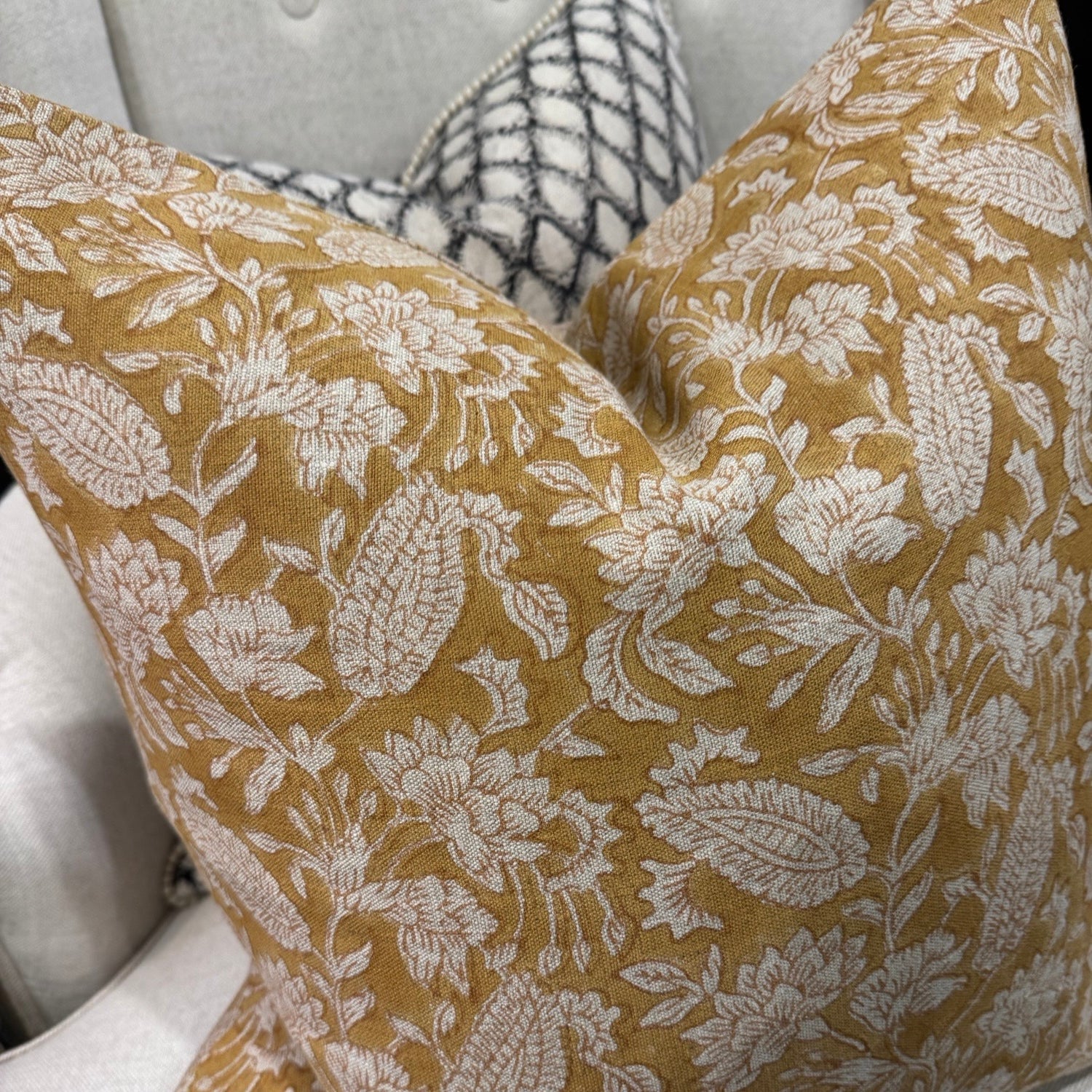 Transform your home decor with the exquisite CHAMOIS Jodhpur Ochre Block Print Linen Cushion. Made with premium Belgian linen and a striking Indian block print pattern, this cushion exudes luxury and durability. With a plush feather insert, experience the beauty and quality of this stunning piece from CHAMOIS.