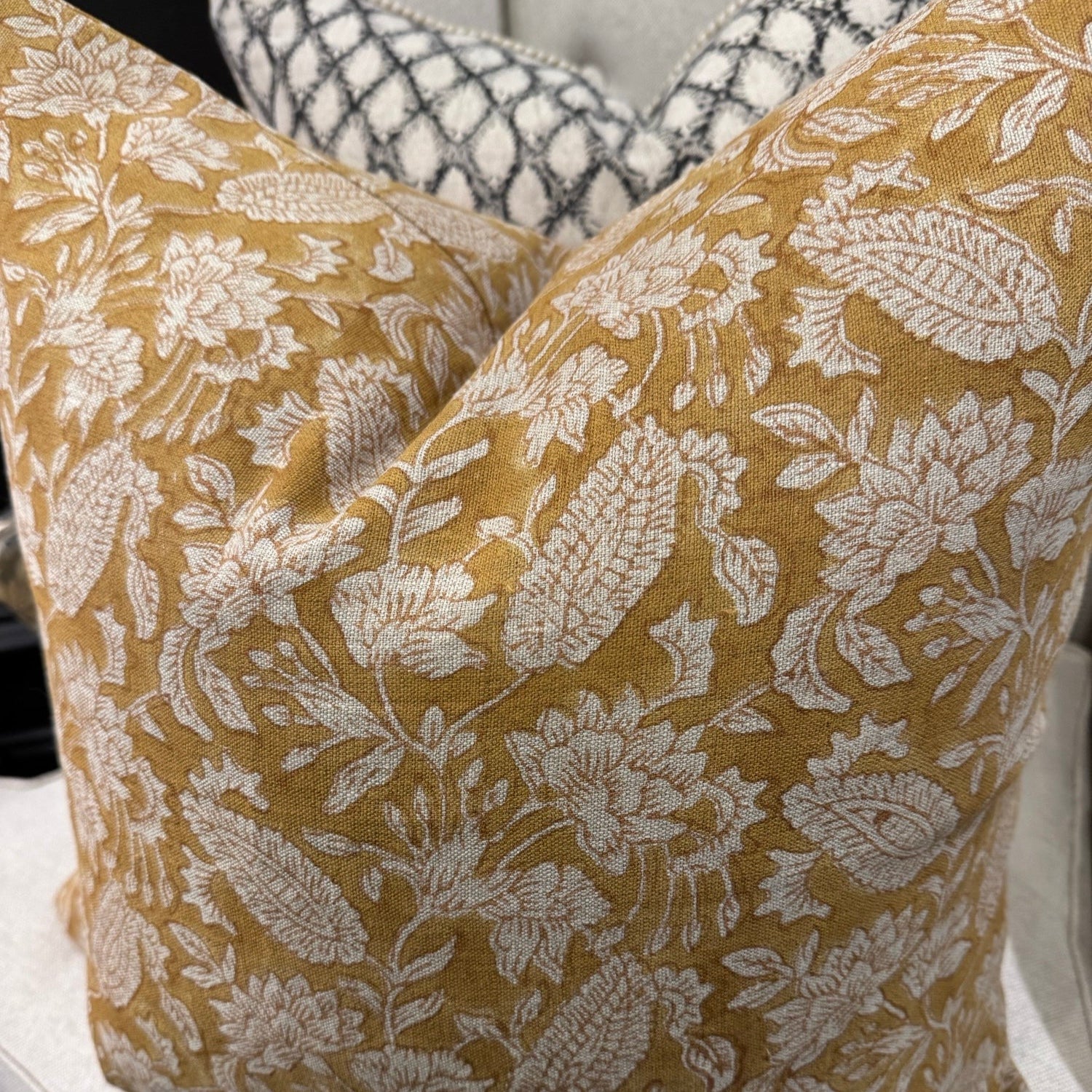 Transform your home decor with the exquisite CHAMOIS Jodhpur Ochre Block Print Linen Cushion. Made with premium Belgian linen and a striking Indian block print pattern, this cushion exudes luxury and durability. With a plush feather insert, experience the beauty and quality of this stunning piece from CHAMOIS.
