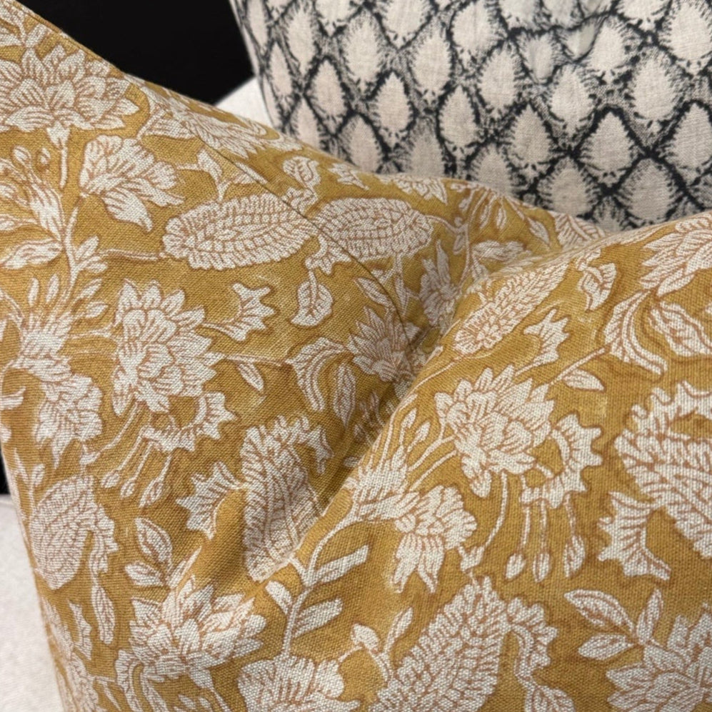 Transform your home decor with the exquisite CHAMOIS Jodhpur Ochre Block Print Linen Cushion. Made with premium Belgian linen and a striking Indian block print pattern, this cushion exudes luxury and durability. With a plush feather insert, experience the beauty and quality of this stunning piece from CHAMOIS.