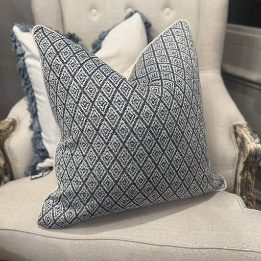 Elevate your home décor with the Hindi Sapphire Cushion crafted from exquisite Slender Morris fabric. Featuring a timeless diamond pattern in soft blue, cream, and taupe tones, it effortlessly complements any cushion arrangement, bringing a refined designer touch to your sofa, chair, or bedroom. Filled with luxurious feathers, it offers exceptional comfort, while the natural self-piping adds a polished, sophisticated finish. The plain natural back enhances its classic appeal, making it a perfect addition to