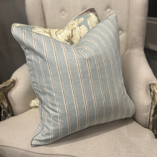 Elevate your home décor with the Slender Morris Duck Egg Blue Ticking Stripe Cushion, crafted from a premium cotton and linen blend. Its understated striped design effortlessly complements any cushion collection, bringing a refined designer touch to your sofa, chair, or bedroom. Filled with soft feathers, it offers exceptional comfort, while the plain duck egg self-piping adds a subtle, stylish finish.