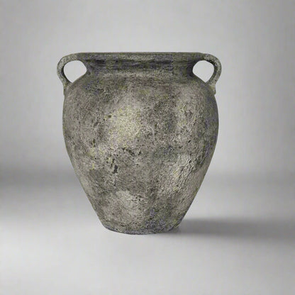 Ancient terracotta jar with two handles on a gray background