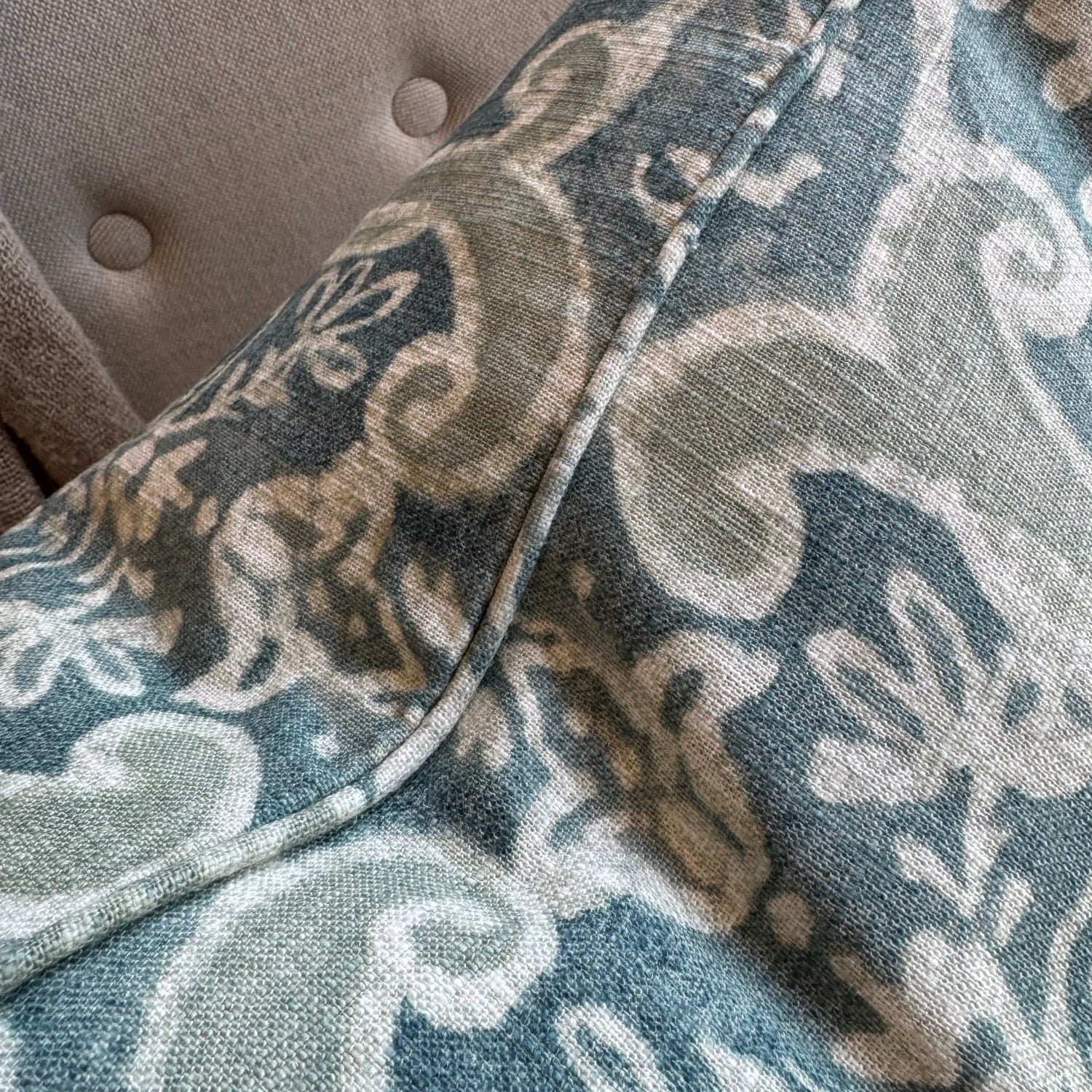 Close-up of a fabric with a floral pattern on a textured surface