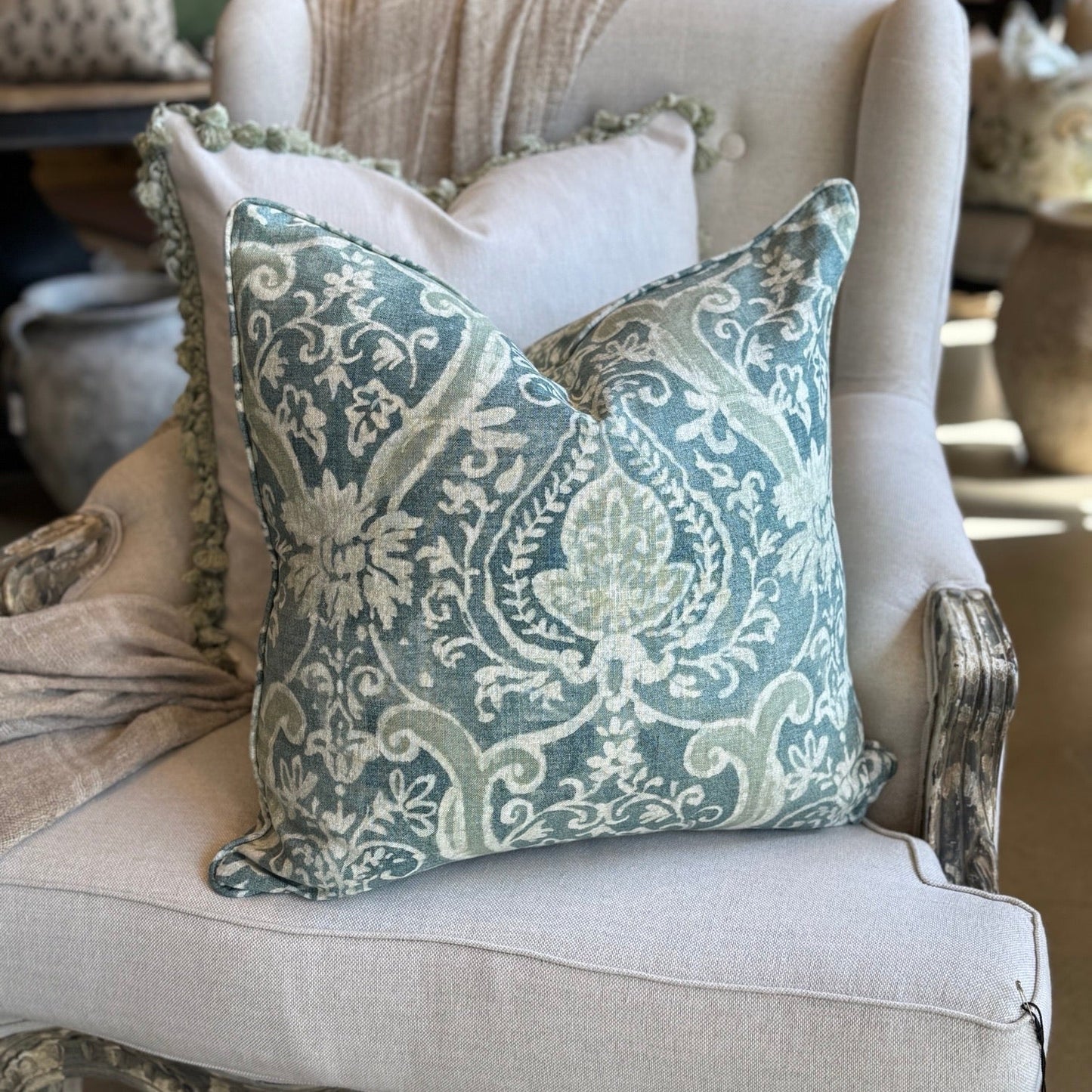 The Florentine Teal & Sage Cushion in sturdy linen blend with feather fill adds elegance, comfort & refined style to any sofa, chair, or bedroom.