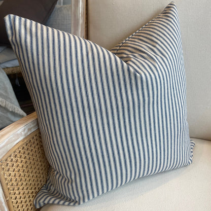 This 50cm x 50cm Navy Ticking Stripe Linen Cushion, made with Warwick Fabric's natural linen, features a timeless elegant pattern. Its heavyweight structure provides an air of sophistication, and its soft feather insert ensures luxurious comfort. Create a statement with this piece by pairing it with either solid or patterned companions.