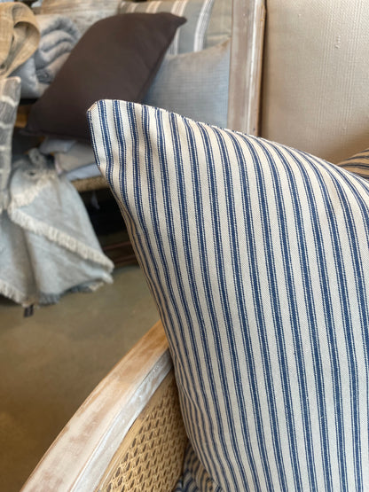 This 50cm x 50cm Navy Ticking Stripe Linen Cushion, made with Warwick Fabric's natural linen, features a timeless elegant pattern. Its heavyweight structure provides an air of sophistication, and its soft feather insert ensures luxurious comfort. Create a statement with this piece by pairing it with either solid or patterned companions. Corner close up