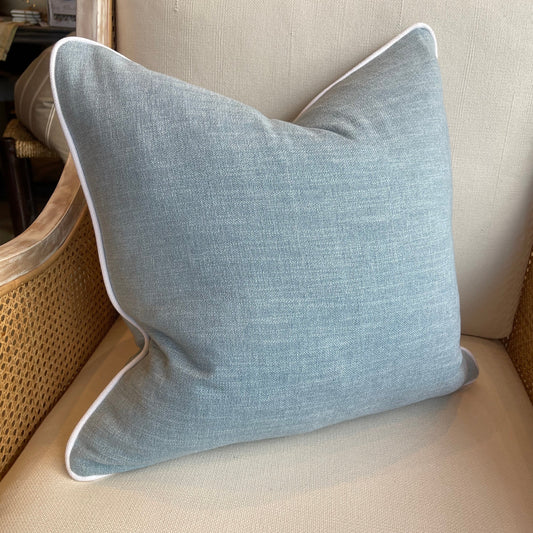 Introducing the exquisite Warwick Soft Blue Linen & Cotton Cushion, made with a fantastic blend of linen and cotton by the renowned house Warwick Fabrics. This luxurious addition to your home decor features elegant white piping and a plush feather insert for ultimate comfort. Complement and coordinate with other cushions effortlessly.