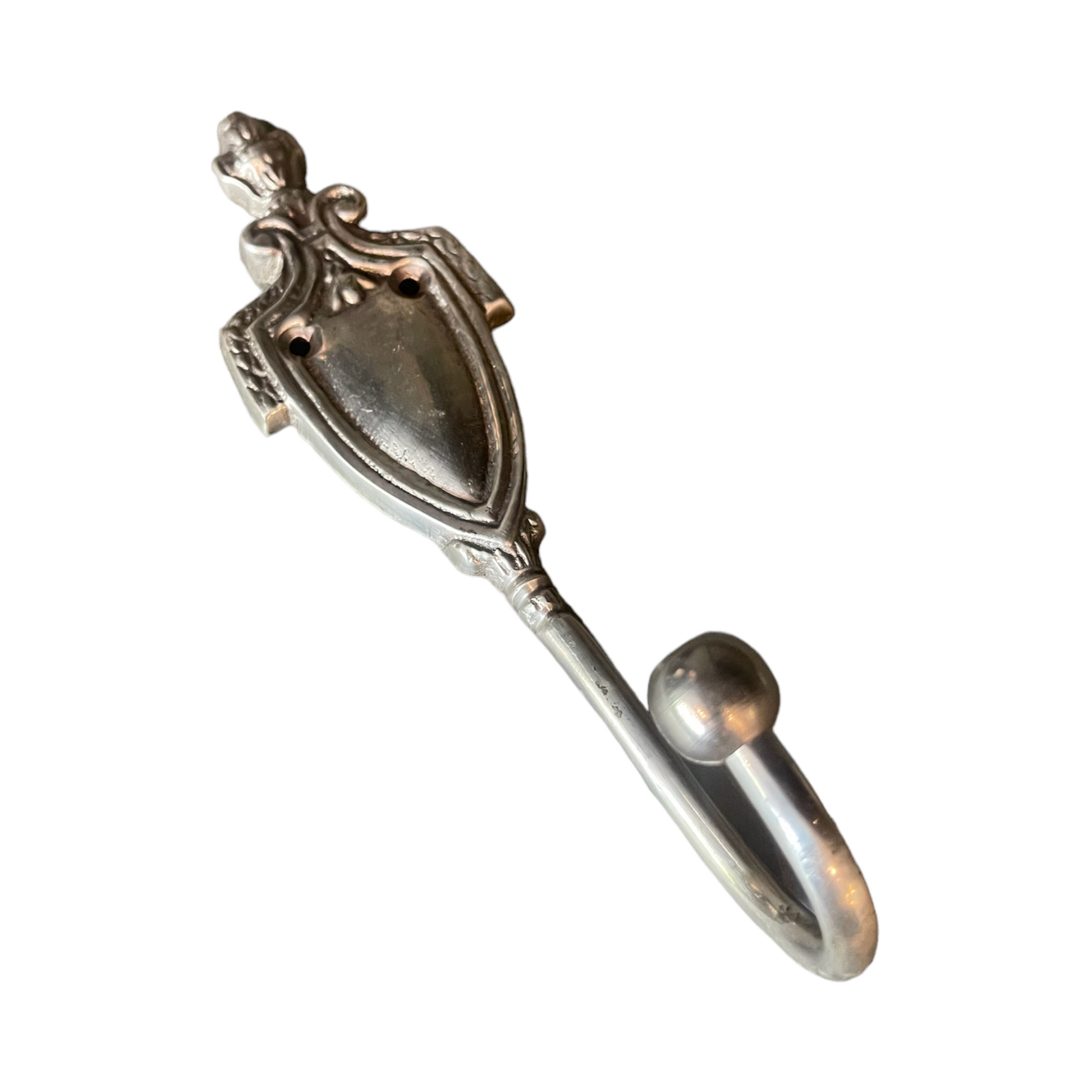 The Royale Silver Hook offers a sophisticated addition to any space, boasting a burnished metal finish adorned with refined detailing. Classic style and function in one item, the Royale Silver Hook is a timeless addition to any decor