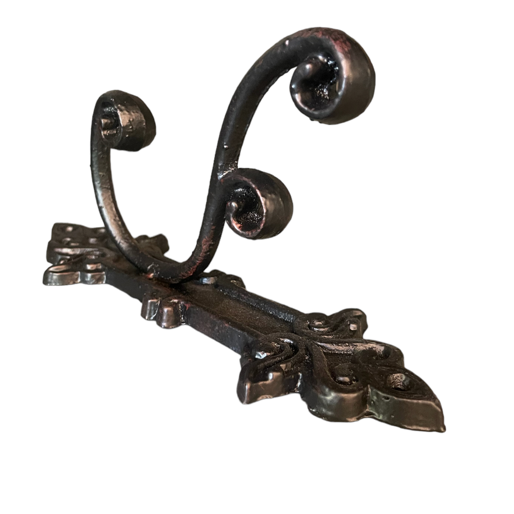 This charming & timeless cast iron hook is perfect in anywhere in the house for additional hanging. 