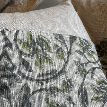 Floral patterned pillow on a textured surface