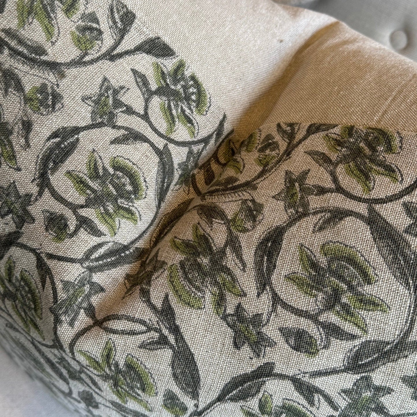 Close-up of a fabric with floral pattern on a neutral background