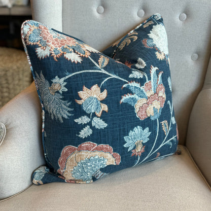 Experience the exquisite craftsmanship of this premium Lily Floral Navy Linen Cushion. Made with a heavy weight linen blend fabric, it features a gorgeous floral design in rich colours on a navy backdrop. Includes a feather insert for added comfort. Side.