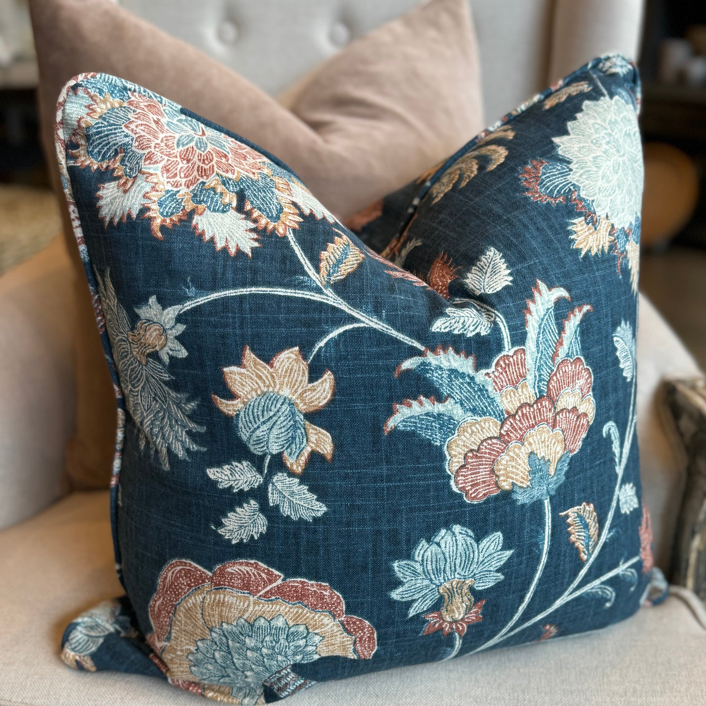 Experience the exquisite craftsmanship of this premium Lily Floral Navy Linen Cushion. Made with a heavy weight linen blend fabric, it features a gorgeous floral design in rich colours on a navy backdrop. Includes a feather insert for added comfort.