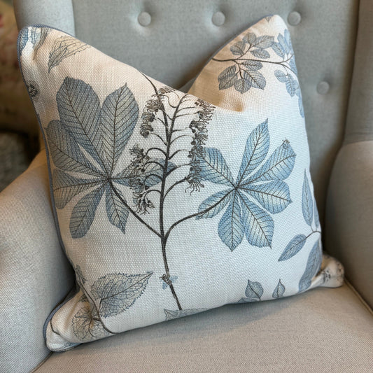 Experience the exquisite craftsmanship of this pretty Penrhyn Beige & Blue Floral Cushion crafted with a Westbury fabric, a renowned textile brand. Made with premium 100% cotton fabric, it showcases a delicate floral design on a cream background. Comes with a luxurious feather insert for unparalleled comfort. The reverse side is lined with a soft blue fabric.