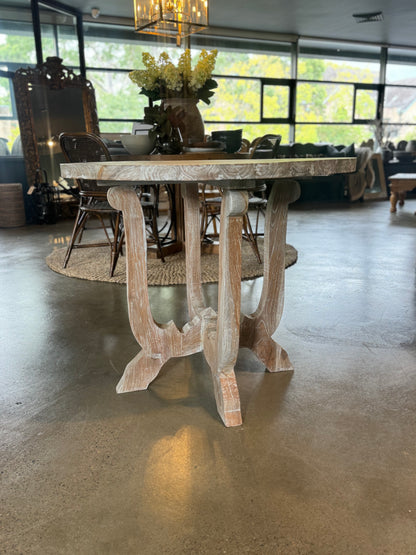 The Henri Teak Table boasts a classic design suitable for any residence. Crafted from sturdy teak wood and featuring a delicate white wash weathered finish, it adds an air of refinement to any space. Front