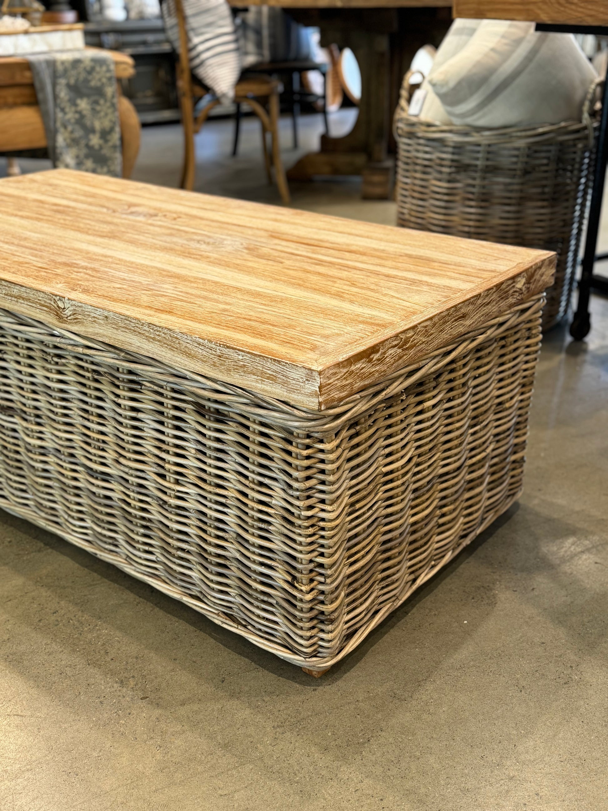 The Setiawan Coffee Table is a stunning addition to any room. The combination of rattan and rustic teak creates a unique and lively texture, enhanced by a delicate whitewash finish. This table brings a dynamic feel and personal touch to your living space. Corner
