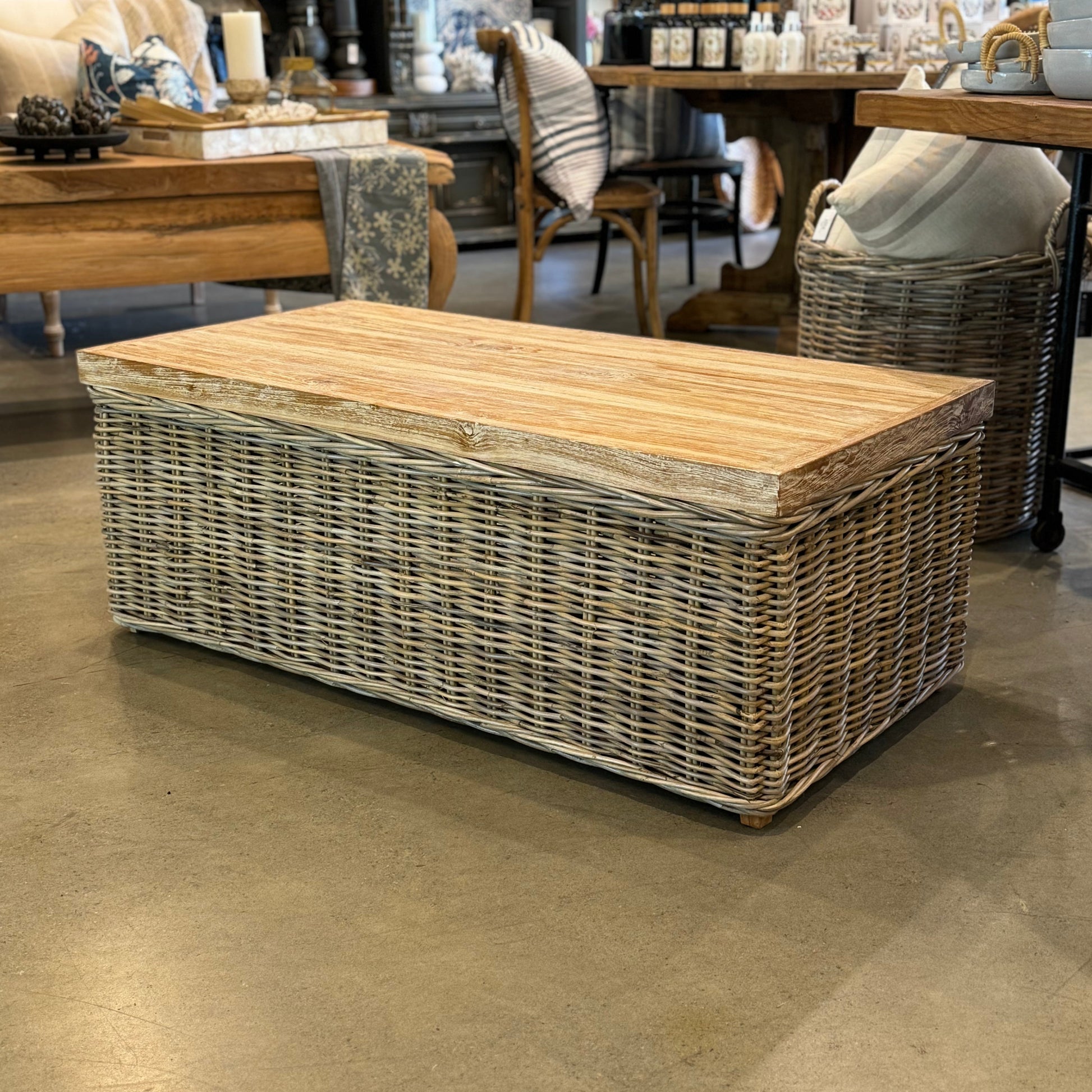 The Setiawan Coffee Table is a stunning addition to any room. The combination of rattan and rustic teak creates a unique and lively texture, enhanced by a delicate whitewash finish. This table brings a dynamic feel and personal touch to your living space. Front