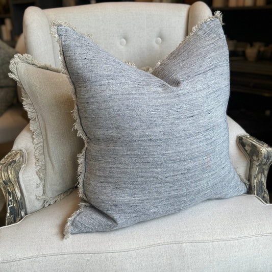 Experience the ultimate in luxury with our Grey Linen Fringed Cushion. Crafted from the finest quality French linen, this cushion radiates an air of elegance and refinement. Its lovely fringed detail adds just the right amount of texture to any room. Styled.