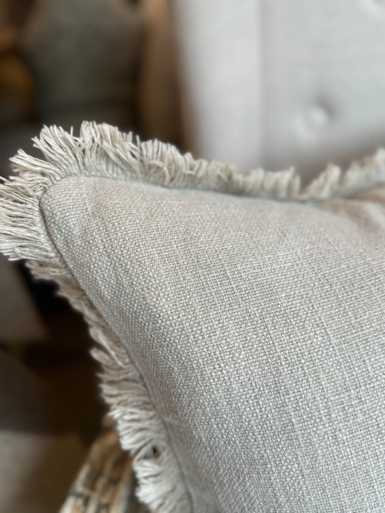 Indulge in the luxurious comfort and elegant style of the Natural Stone Fringed Lumbar Cushion. Made with exquisite heavyweight French linen, this cushion adds sophistication and warmth to any home décor. With its timeless design and subtle colour hue, it is sure to create an inviting and tasteful atmosphere in your space. Styled.