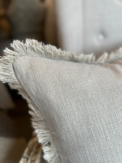 Indulge in the luxurious comfort and elegant style of the Natural Stone Fringed Lumbar Cushion. Made with exquisite heavyweight French linen, this cushion adds sophistication and warmth to any home décor. With its timeless design and subtle colour hue, it is sure to create an inviting and tasteful atmosphere in your space. Styled.