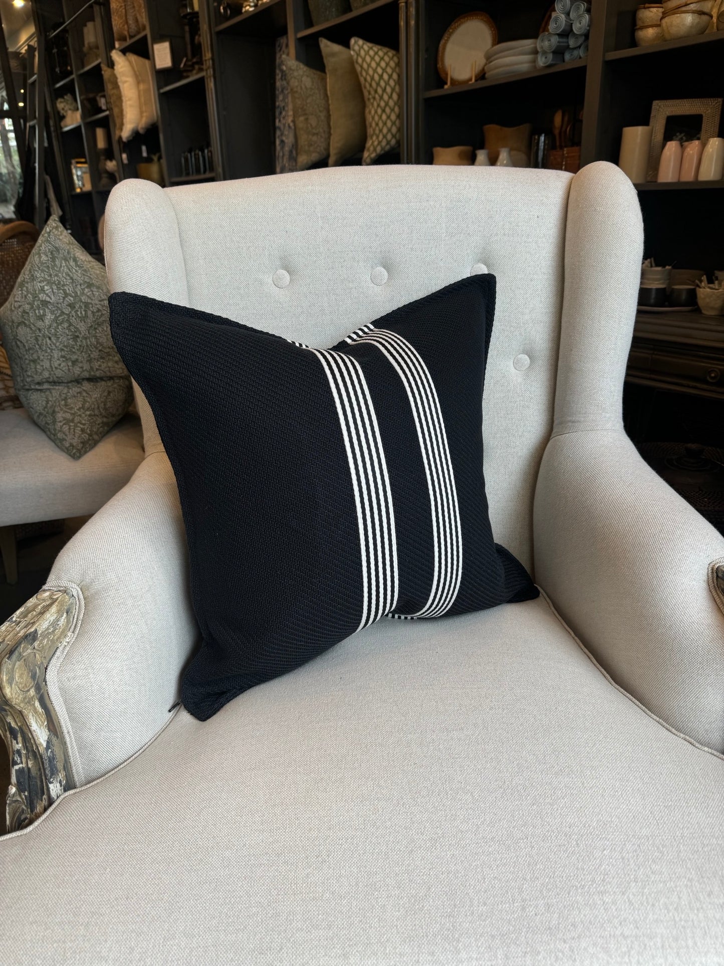 Channeling the sleek elegance of Milano's fashion district, each Black & White Herringbone Striped Cushion features the striking contrast of black and white, evoking the timeless beauty of the marble found in both ancient Italian villas and modern Milanese ateliers. Styled.