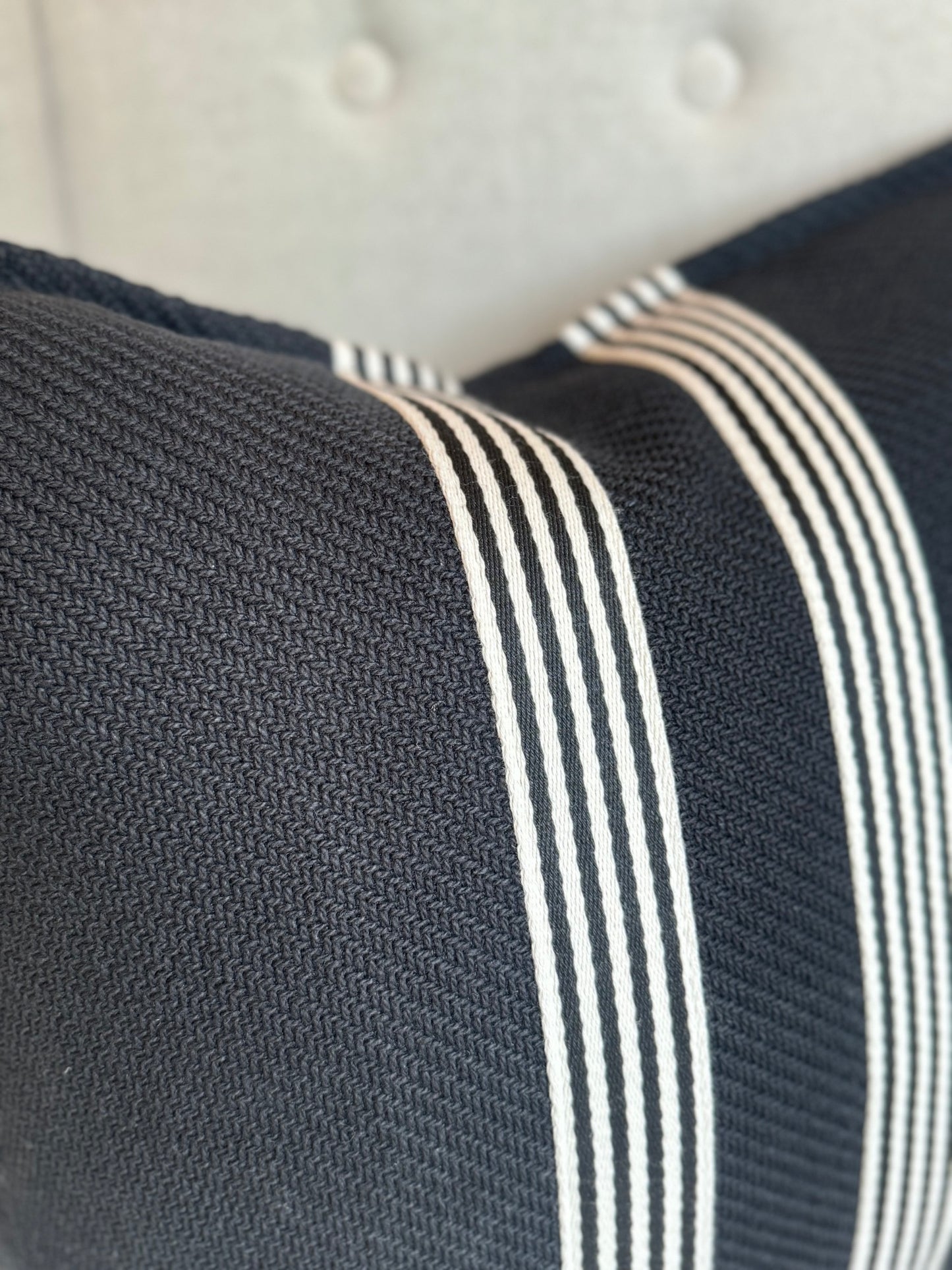 Channeling the sleek elegance of Milano's fashion district, each Black & White Herringbone Striped Cushion features the striking contrast of black and white, evoking the timeless beauty of the marble found in both ancient Italian villas and modern Milanese ateliers. Styled.