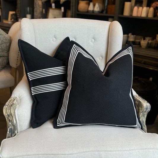 Channeling the sleek elegance of Milano's fashion district, each Black & White Herringbone Textured Cushion features the striking contrast of black and white, evoking the timeless beauty of the marble found in both ancient Italian villas and modern Milanese ateliers.