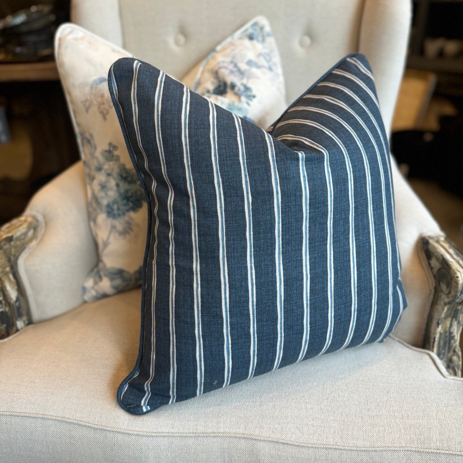 Embrace the luxurious softness of Slender Morris fabric with the Boston Blue and White Rowing Stripe Linen Cushion. Featuring a bold navy and light blue striped design, this cushion is double-sided and self-piped for a polished look. Plus, our feather insert ensures the ultimate comfort. The reverse is lined with oatmeal linen, adding the perfect finishing touch.