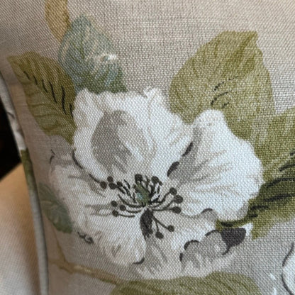 Feel the masterful artistry of Claudié's Taupe Floral Linen Cushion. Handcrafted from Warwick Fabrics' high quality material, this cushion boasts a stunning floral pattern in soft light blue and pale green against a neutral taupe backdrop. A feather insert provides unmatched comfort, and the reverse side is lined with matching taupe linen.