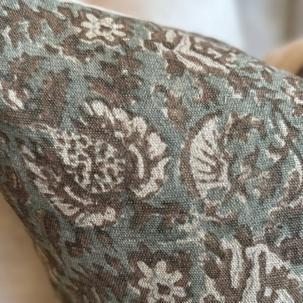 Create an atmosphere of elegance and sophistication in your home with the Claudette Floral Linen Cushion. Its stunning floral print, in muted brown, white, and green tones, is sure to add a touch of nature to any room. And with a soft linen material and included feather insert, it's the perfect addition to your cozy and stylish decor. Don't miss out on this beautiful piece!