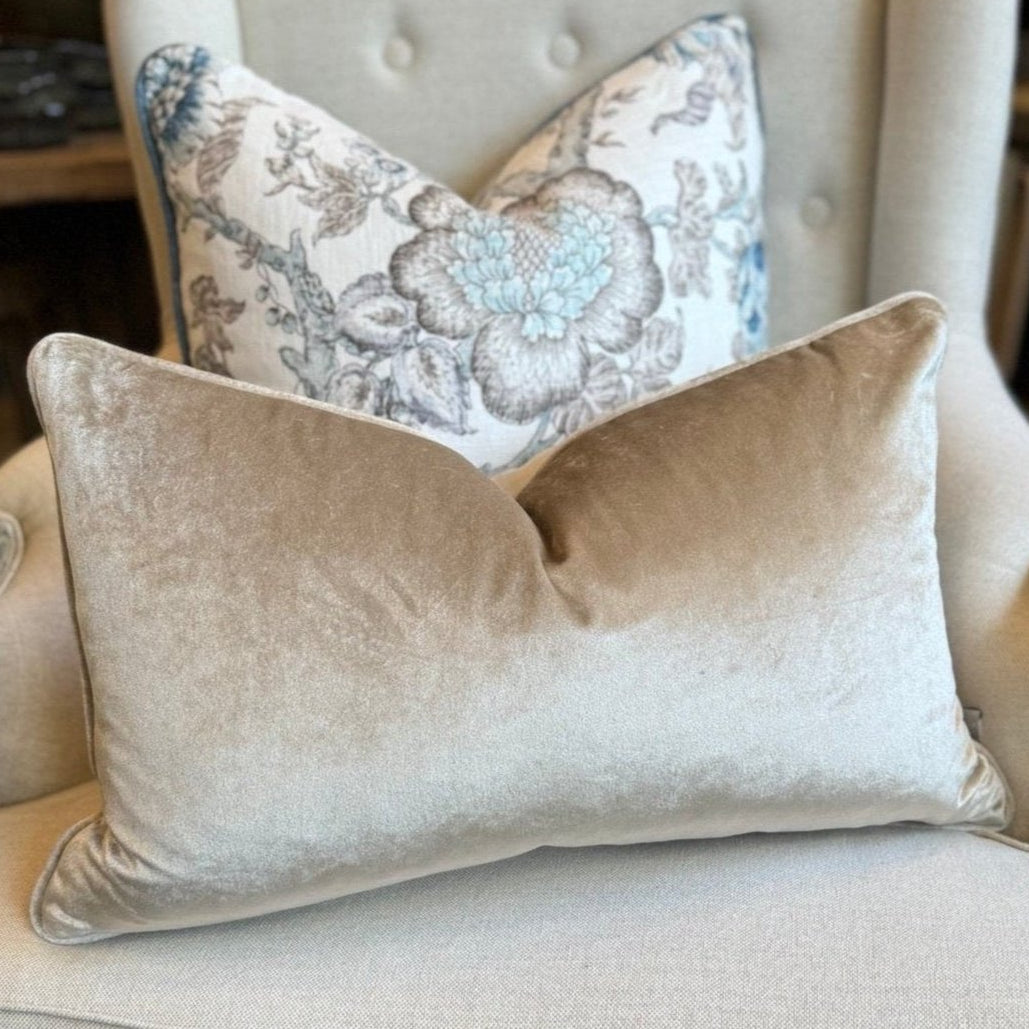 Indulge in the opulent comfort of the Champagne Velvet Lumbar Cushion. This superb cushion enhances any room with its sophisticated design and features a discreet zipper for easy handling. Filled with feather inserts for unparalleled coziness and conveniently machine washable on a delicate cycle. The stunning champagne colour exudes an air of refinement and complements a range of hues