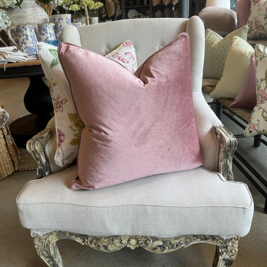 Experience the luxurious softness of our Dusty Pink Velvet Cushion. Elevate any space with style and opulence, featuring a hidden zipper for easy use. Filled with feather inserts for ultimate comfort and conveniently machine washable on a delicate cycle. Its stunning colour is perfect for layering with other cushions on a sofa or in the bedroom.