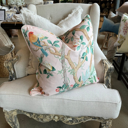 Experience the beauty of nature with this vibrant apricot pink cotton cushion, featuring charming birds, delicate butterflies, and lush botanicals. Add a pop of color to any space and elevate your home decor with this lovely accent cushion, complete with a soft duck feather insert.