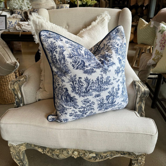 Elevate your living space with the timeless elegance of this classic blue and white toile cushion. The delicate vintage print adds a touch of sophistication, while the bold white background creates a striking contrast. And with its plush duck feather insert, it's the perfect accent piece to add comfort and style to any room.