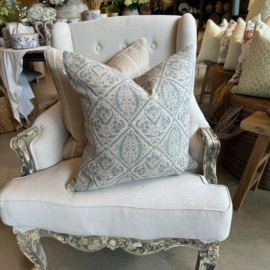 Experience the beauty and quality of CHAMOIS' Jaipur Dusty Blue Linen Cushion - a stunning addition to any interior. Meticulously crafted with a striking Indian block print pattern on premium 100% Belgian linen, this cushion exudes luxury and durability. Complete with a plush feather insert, elevate your home decor with this exquisite piece from CHAMOIS.