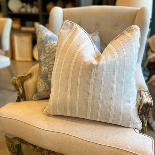 The James Striped Linen cushion is a must-have for any home! Its versatility allows it to complement any color scheme, while its subtle stripes add a touch of intrigue. Complete with a feather insert, this cushion offers unbeatable comfort. Front Close-up 1