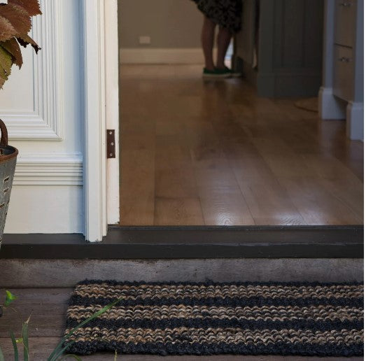 The Jones Stripe Jute Mat adds a tasteful layer of texture and style to your home. Handcrafted with a unique graphite and natural stripe, this oversized mat looks terrific on both concrete and timber floors. Perfect for undercover outdoor spaces, the mat adds interest and personality to hallways and entryways. 
